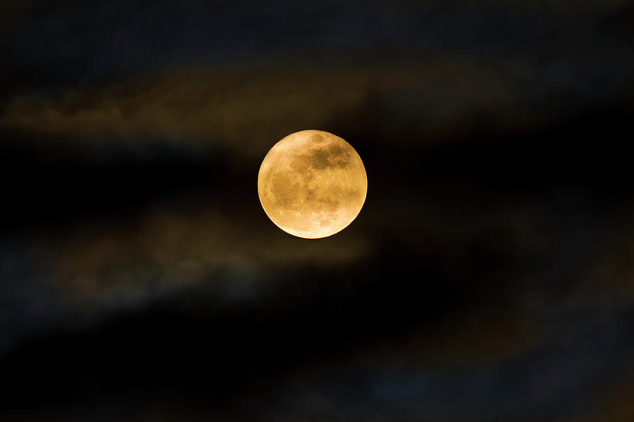 Super Moon Seen Through The Clouds Photograph by Diane Labombarbe