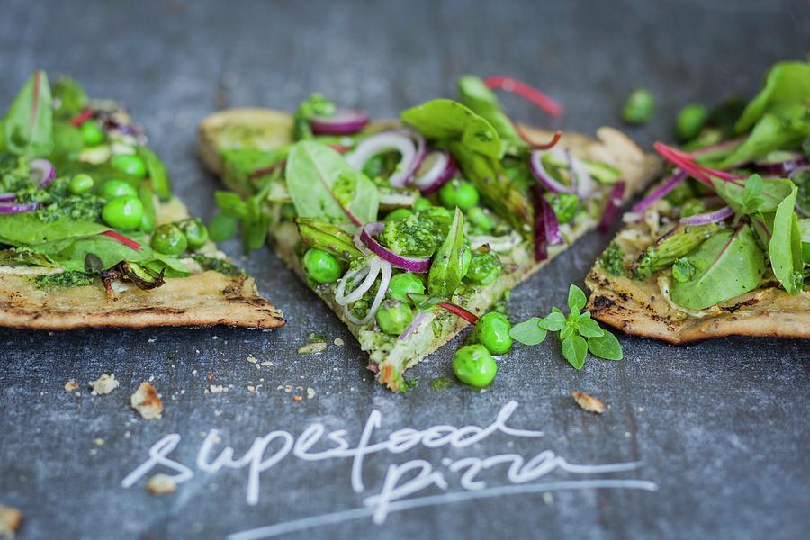 Superfood Pizza With Red-veined Dock, Peas, Asparagus, And Pesto Photograph by Eising Studio