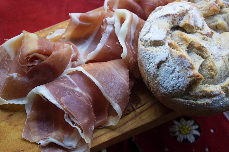 Supper With Vinschgau Bread rye-wheat Sour Dough And Air-dried Country Ham On A Wooden Board Photograph by Charlotte Von Elm