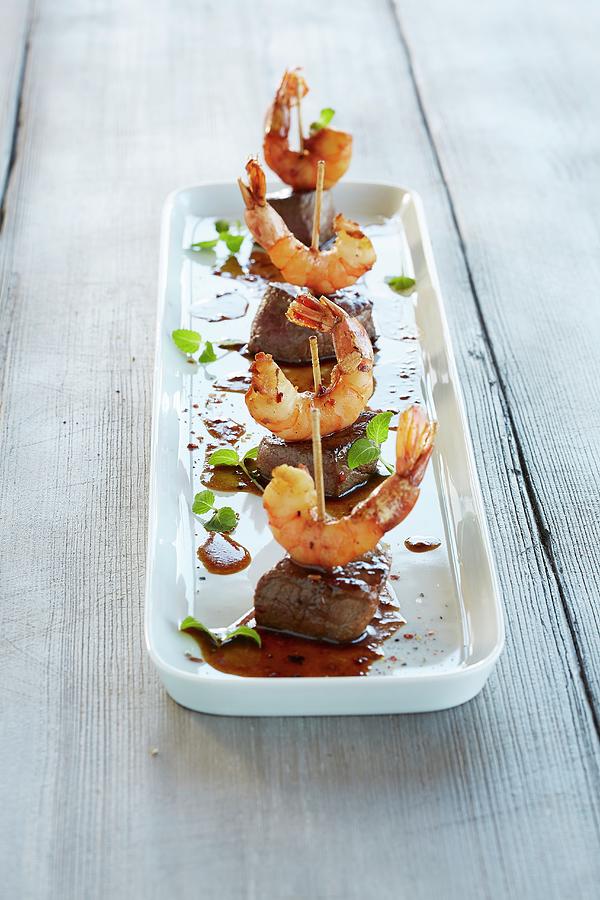 Surf And Turf: Meat Skewers With Shrimp Photograph by Rafael Pranschke