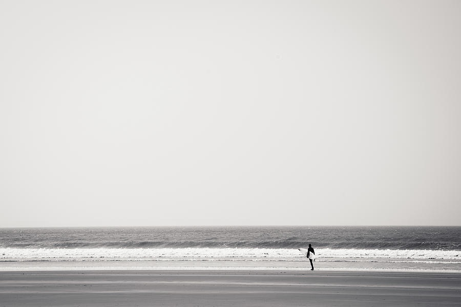 Surfer At Newgale Beach, Wales Photograph by Elaine W Zhao