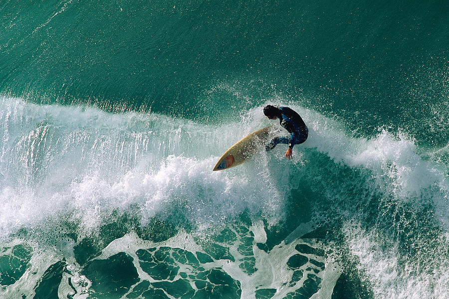 Surfer Riding Wave Photograph by Stockbyte