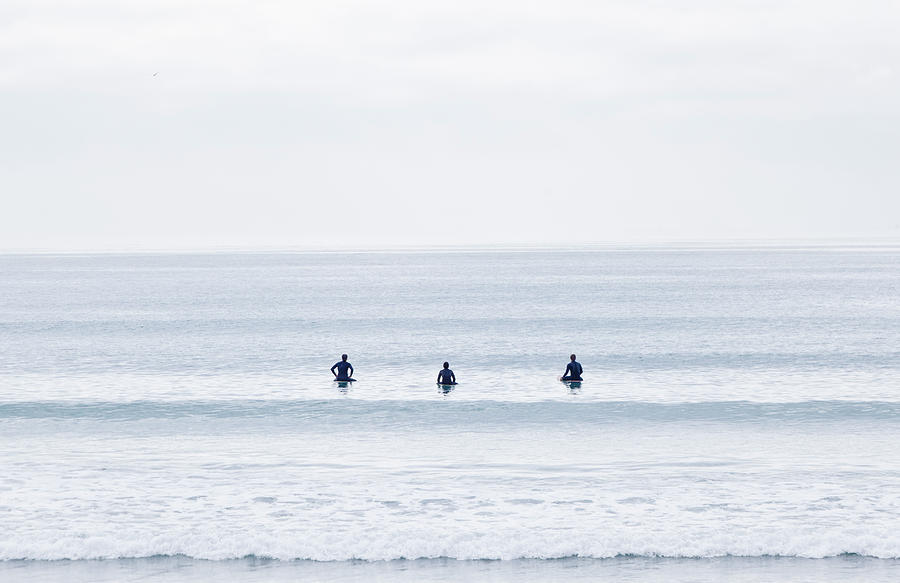 Surfers Astride Boards Waiting For Wave Photograph by David Madison