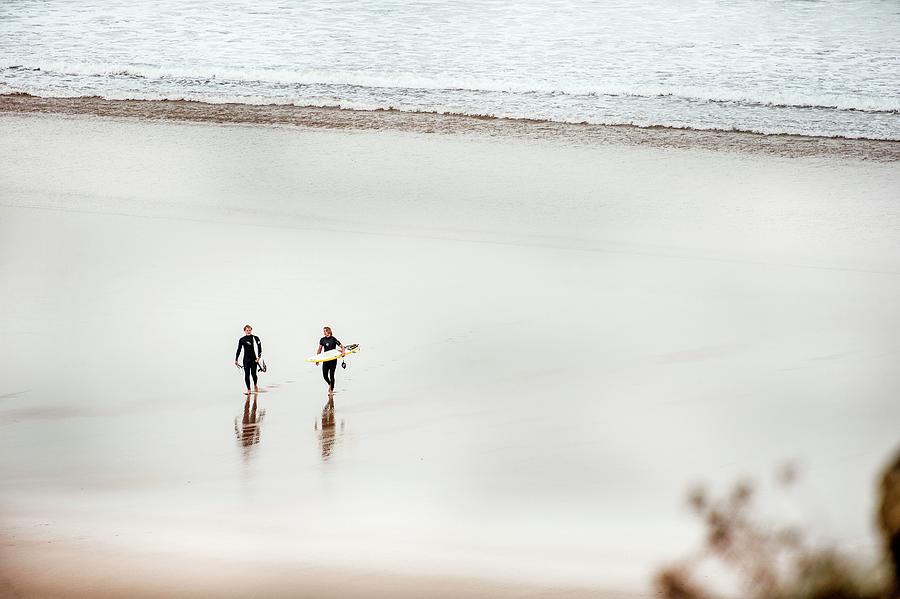 Surfers Walking On Beach Digital Art by Pete Goding