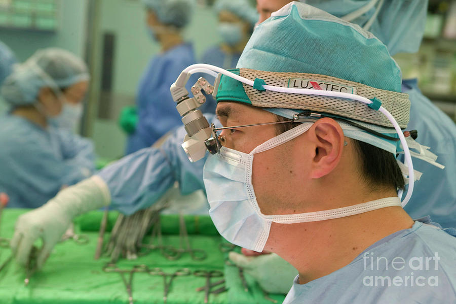 Surgeon Wearing Binocular Glasses Photograph by Medicimage / Science Photo Library