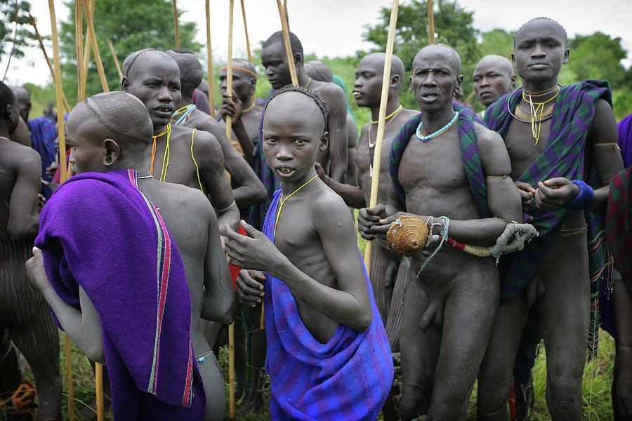 Suri Tribal Warriors With Sticks At Photograph by Timothy Allen