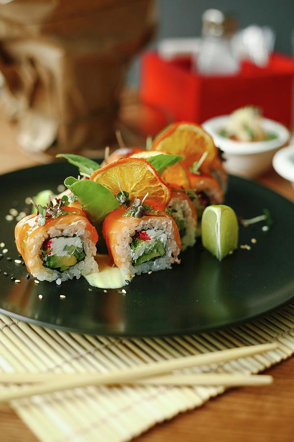 Sushi Rolls With Salmon, Avocado, Fresh Cheese And Herbs Photograph by Kuzmin5d