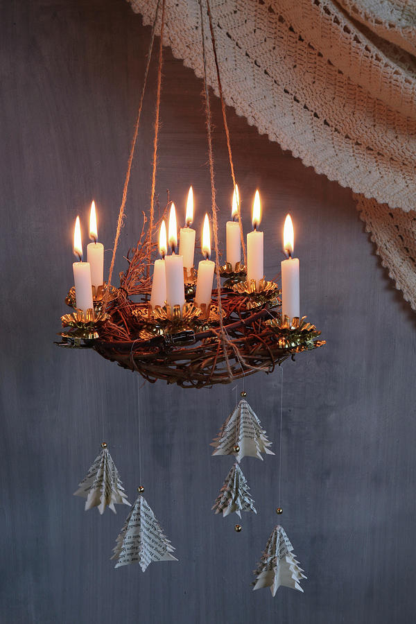 Suspended Advent Wreath Made From Branches With Lit Candles And Fir-tree Pendants Made From Book Pages Photograph by Regina Hippel