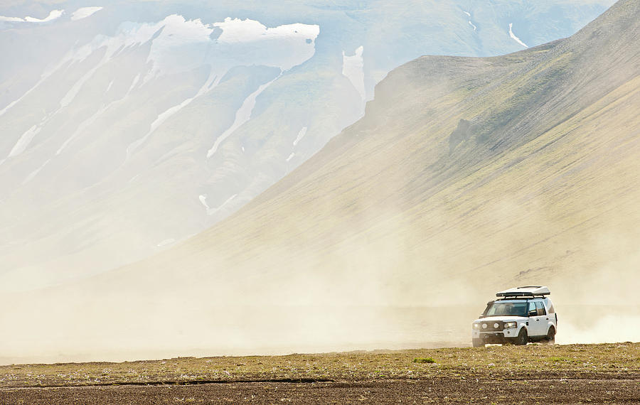 Suv Driving Through The Dusty Interior Of Iceland Photograph by Cavan ...