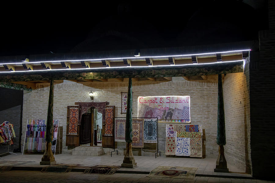 Suzani and carpet bazaar at night, Bukhara, Uzbekistan Photograph by Karen Foley