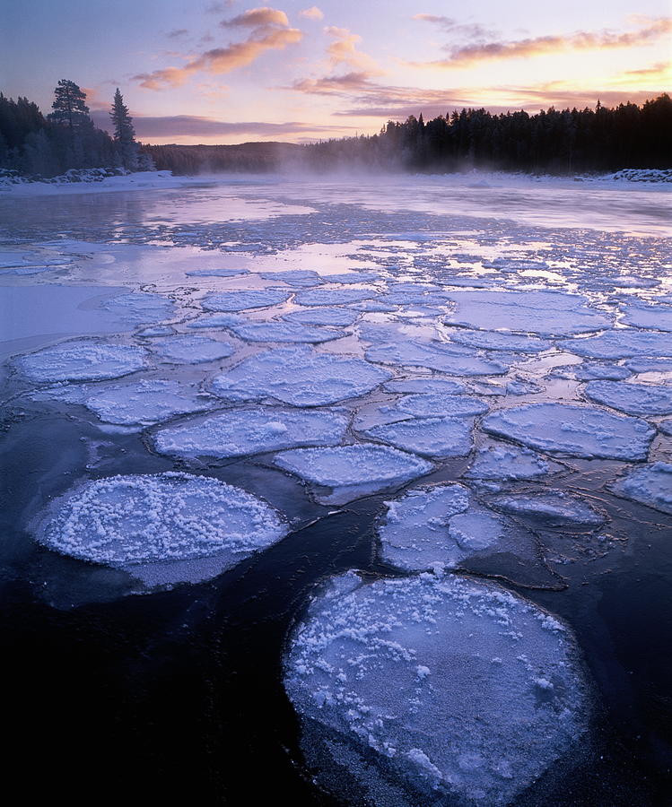 Sweden, Ice Patches On River At Sunset Photograph by Roine Magnusson