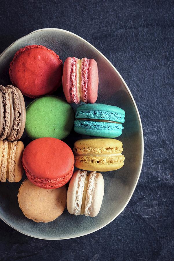 Sweet And Colorful Macaroon Cookies In The Plate On Dark Background Photograph by Ltummy