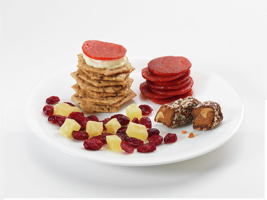 Sweet And Savoury Snacks On Plates: Crackers, Sausages, Dried Fruits And Sweets Photograph by Jim Scherer