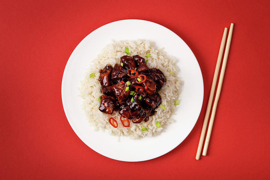 Sweet And Sour Meat Stir Fry In Sticky Sauce With Rice On White Plate With Wooden Chopsticks, Traditional Chinese Dish Photograph by Olena Yeromenko