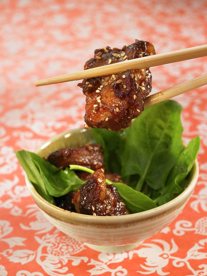 Sweet And Sour Pork With Sesame Seeds And Spinach Shoots Photograph by Lawton