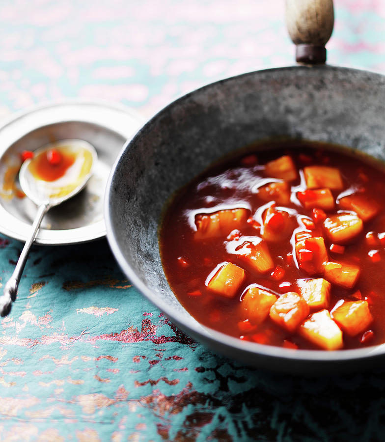 Sweet And Sour Sauce With Pineapple, Chillies And Carrots In A Wok Photograph by Karen Thomas