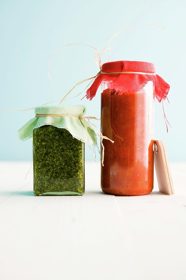 Sweet And Spicy Pepper And Tomato Sugo Next To Basil And Lemon Pesto Photograph by Michael Wissing