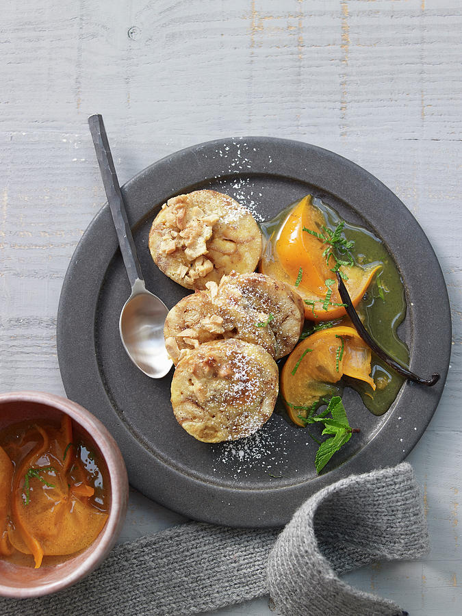 Sweet, Baked Brioche Dumplings With Peanut Caramel And Sharon Fruit Compote Photograph by Jan-peter Westermann / Stockfood Studios