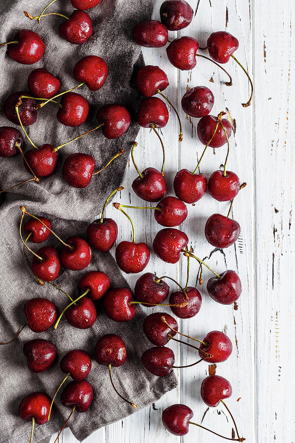 Sweet Cherry On A White Wooden Table Photograph by Kristina Zvereva