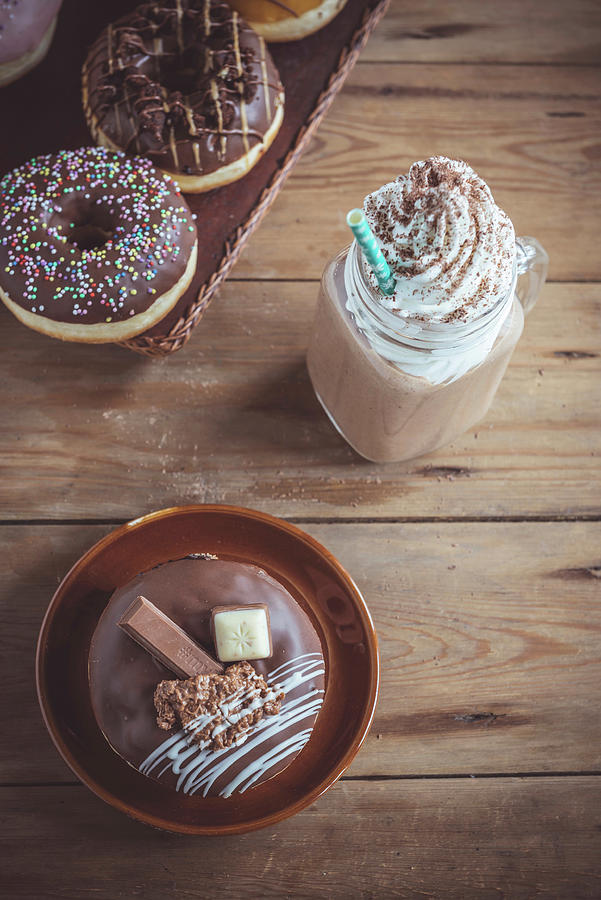 Sweet Chocolate Donuts And Cream Coffee On Wooden Background Photograph by Ltummy