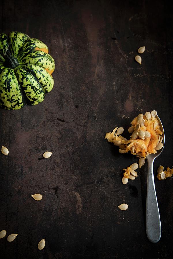 Sweet Dumpling Pumpkin With Pulp And Pumpkin Seeds Photograph by Eising Studio