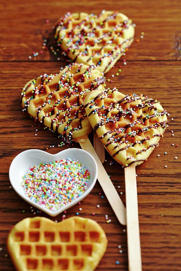 Sweet Heart-shaped Waffles On Sticks With Sugar Pearls Photograph by Teubner Foodfoto