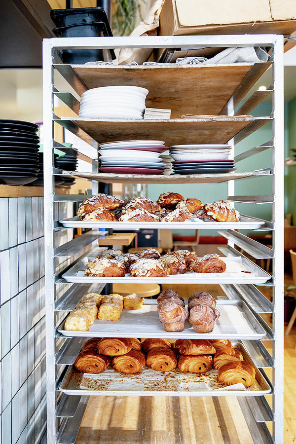 Sweet Pastries On A Shelf In A Bakery Photograph by Claudia Timmann