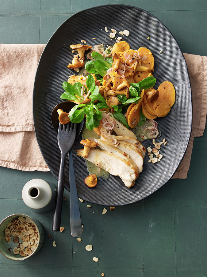 Sweet Potato And Chanterelle Salad With Chicken Breast Photograph by Jan-peter Westermann