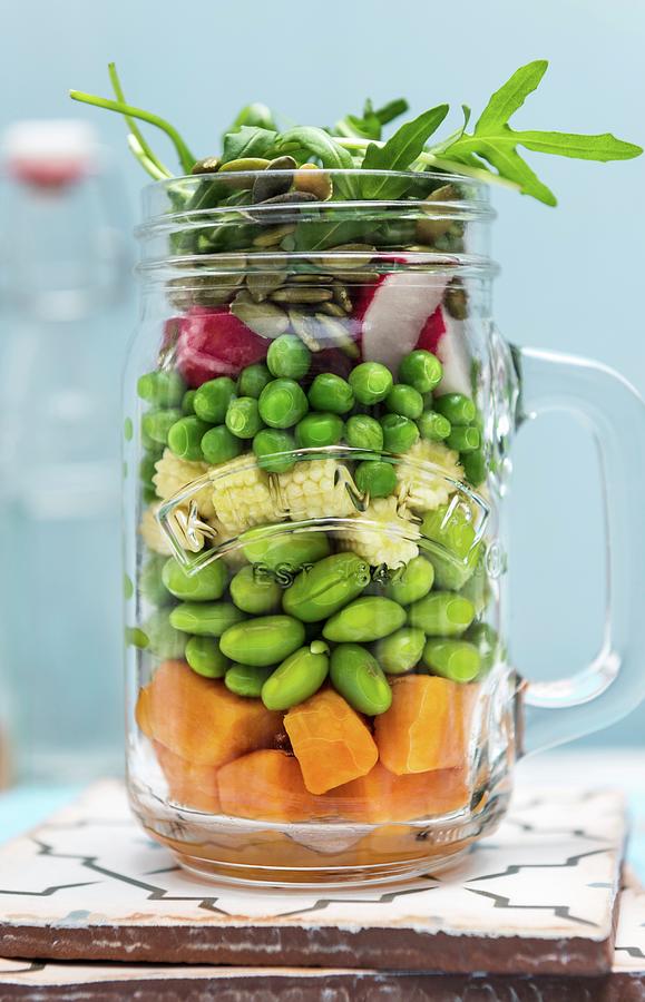 Sweet Potato Beans And Peas With Radishes And Pumpkin Seeds In A Jar Photograph by Komar