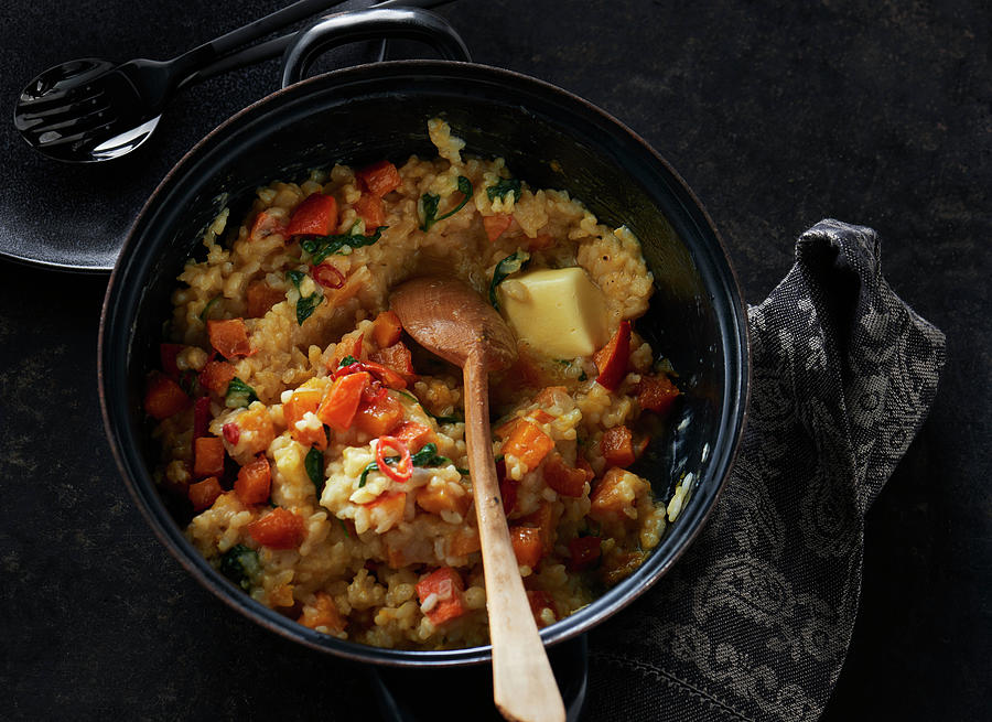 Sweet Potato Risotto With A Piece Of Butter In A Saucepan Photograph by Stefan Schulte-ladbeck