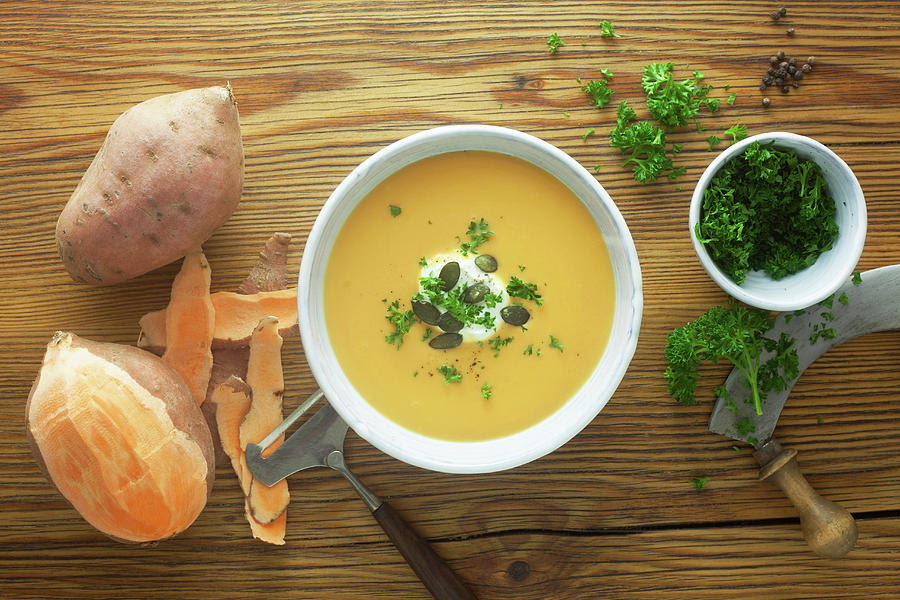 Sweet Potato Soup With Ingredients On A Wooden Surface Photograph by Barbara Pheby