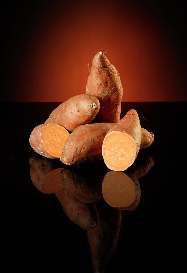 Sweet Potatoes Against A Dark Background Photograph by Petr Gross
