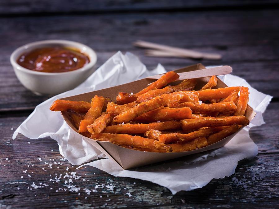 Potato Photograph - Sweet Potatoes Fries With Barbecue Sauce by Christian Schuster