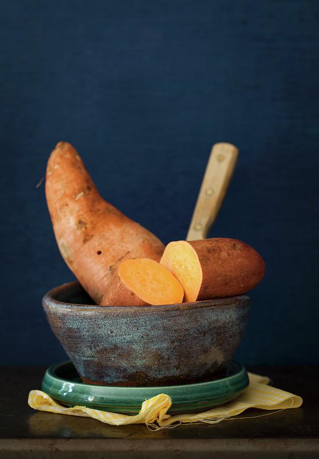 Sweet Potatoes In A Ceramic Bowl Photograph by Yelena Strokin
