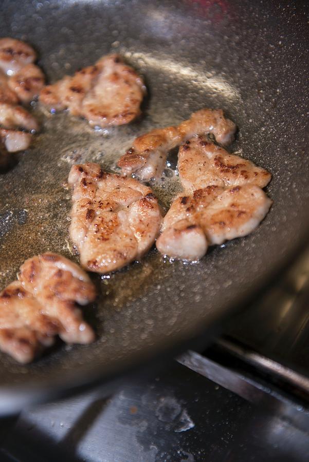 Sweetbreads Fried In Butter In A Pan Photograph by Michael Schinharl