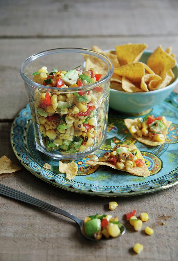 Sweetcorn And Avocado Salsa With Limes And Tomatoes Served With Tortilla Chips Photograph by Victoria Firmston