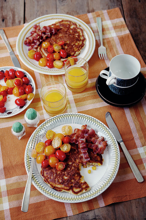 Sweetcorn Pancakes With Cherry Tomatoes And Crispy Bacon Photograph by Ulrika Ekblom