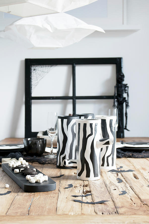 Sweets And Handmade Tealight Holders With Tree Trunk Motifs For Halloween Photograph by Astrid Algermissen