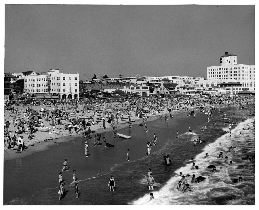 Swimmers At A Crowded Beach In Santa Photograph by American Stock Archive