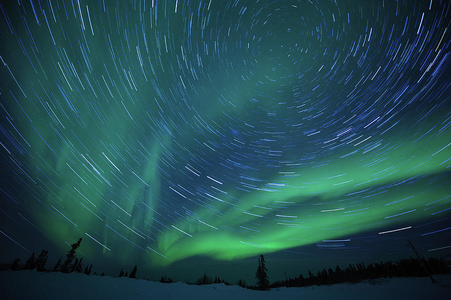 Swirling Aurora Borealis Photograph by Noppawat Tom Charoensinphon