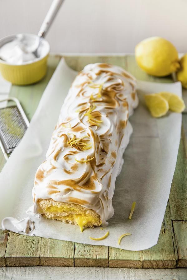 Swiss Roll With Lemon Curd And Meringue Topping Photograph by Magdalena Hendey