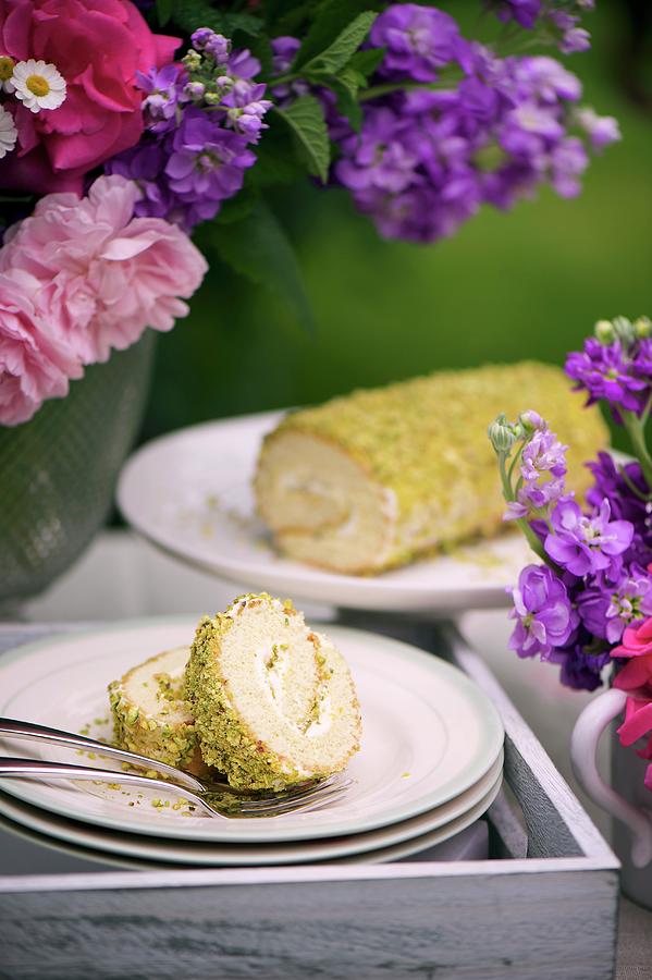 Swiss Roll With Pistachios And Rose Water On A Cake Buffet Photograph by Winfried Heinze