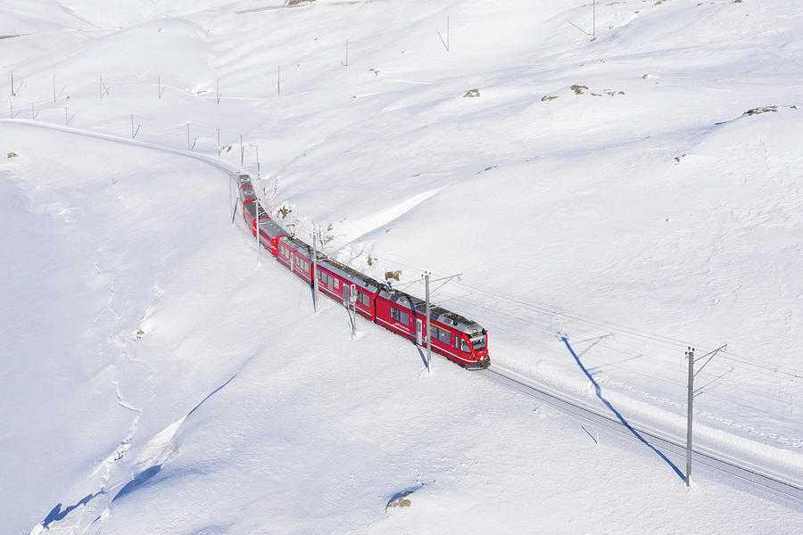 Switzerland, Graubunden, Grisons, Engadin, Alps, The Bernina Express Train At The Bernina Pass Digital Art by Alessandro Bellani