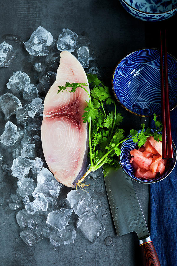 Swordfish Steak On Ice Next To Coriander, A Knife And An Oriental Bowl Photograph by Katrin Winner