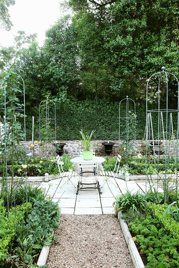 Symmetrically Arranged Vegetable Beds With Small, Trophy-shaped Fountains In Background Photograph by Great Stock!