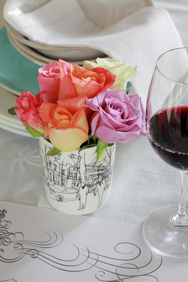 Table Centrepiece Of Roses Next To Glass Of Red Wine Photograph by Great Stock!