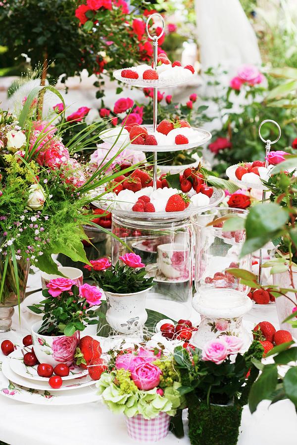 Table Decorated With Summery Arrangement Of Cake Stands, Fruit & Roses Photograph by Alexandra Panella