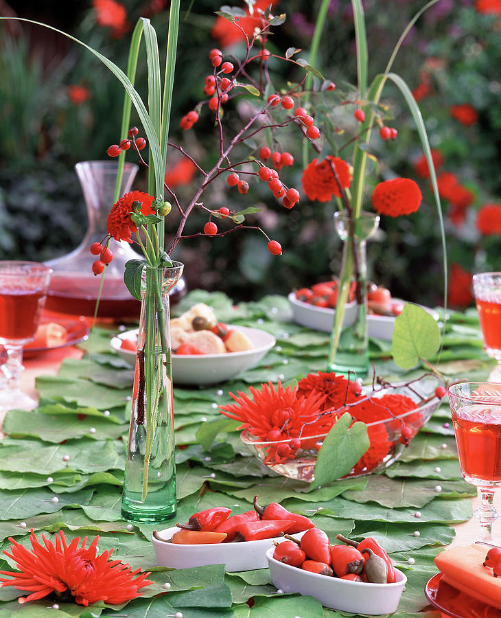 Table Decoration: Pipevine Leaves, Peppers & Dahlias Photograph by Friedrich Strauss
