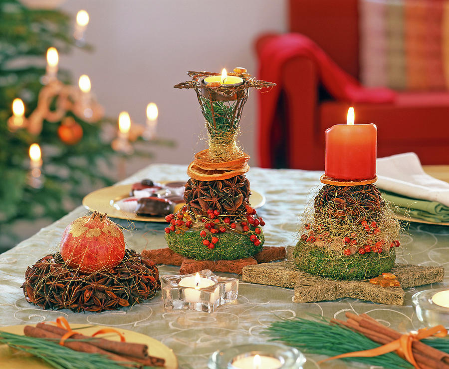 Table Decoration With Star Anise Balls, Wreaths And Candles Photograph by Friedrich Strauss
