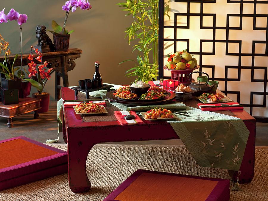 Table Laid With Oriental Dishes In Oriental Room Photograph by Jon Edwards Photography
